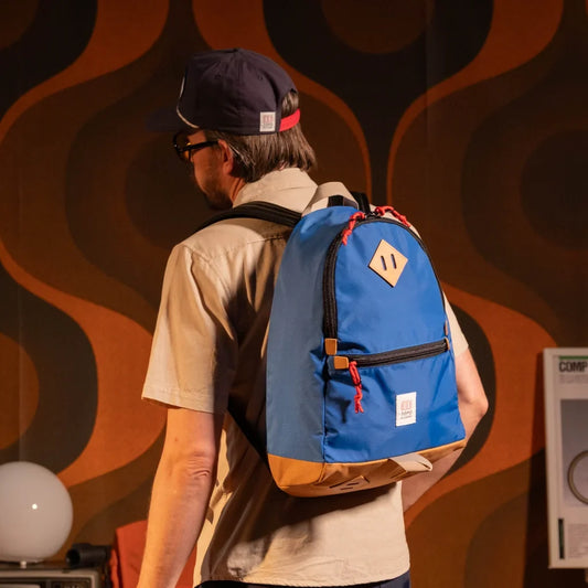 General model view of Topo Designs Classic Teardrop Backpack in "Classic Blue"