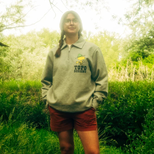 General lifestyle image of Topo Designs x TSPTR Woodstock 1/4 Zip in "Grey Marl"