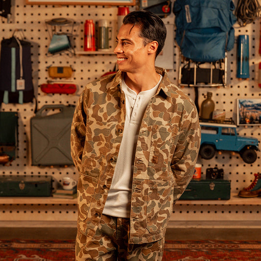 Man wearing a "Duck Camo" Utility Jacket