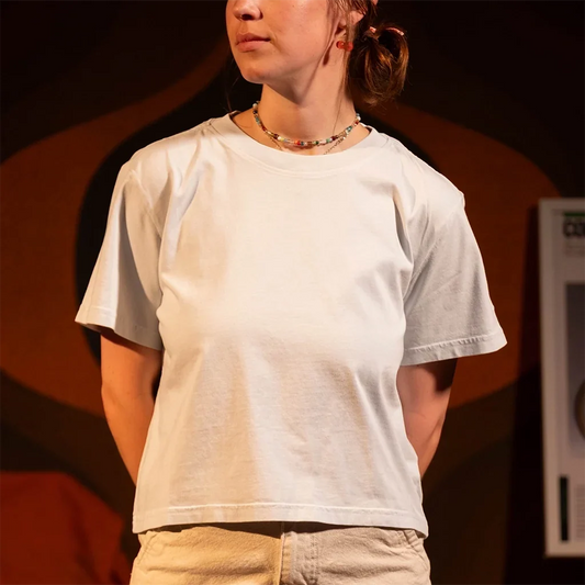 General front model shot of Topo Designs Dirt Tee - Women's in "Bone White"