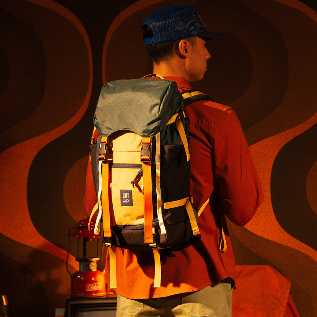 General lookbook on model photo of Rover Trail Pack in "Forest / Goldenrod"