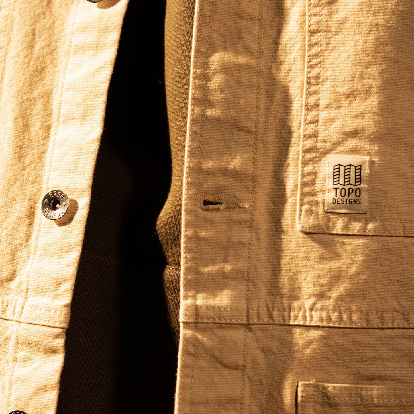 General model shot of Front view of Topo Designs Utility Jacket Undyed - Men's in "Undyed"