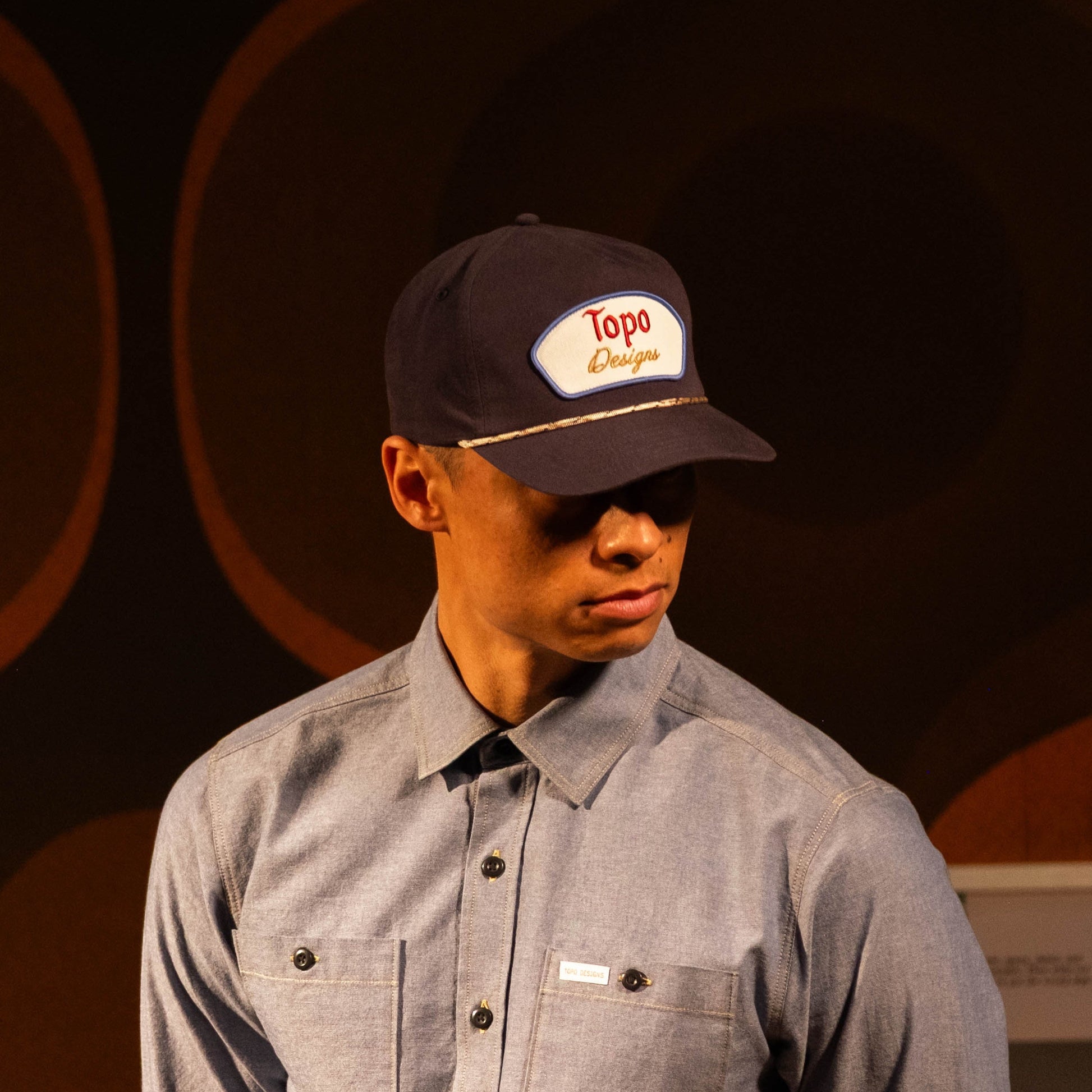General lookbook photo of model wearing Topo Designs Utility Shirt - Men's in "Blue Chambray"