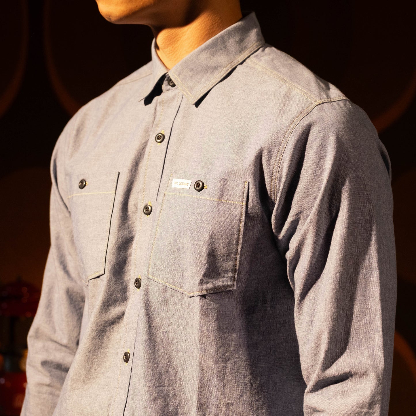General lookbook photo of model wearing Topo Designs Utility Shirt - Men's in "Blue Chambray"