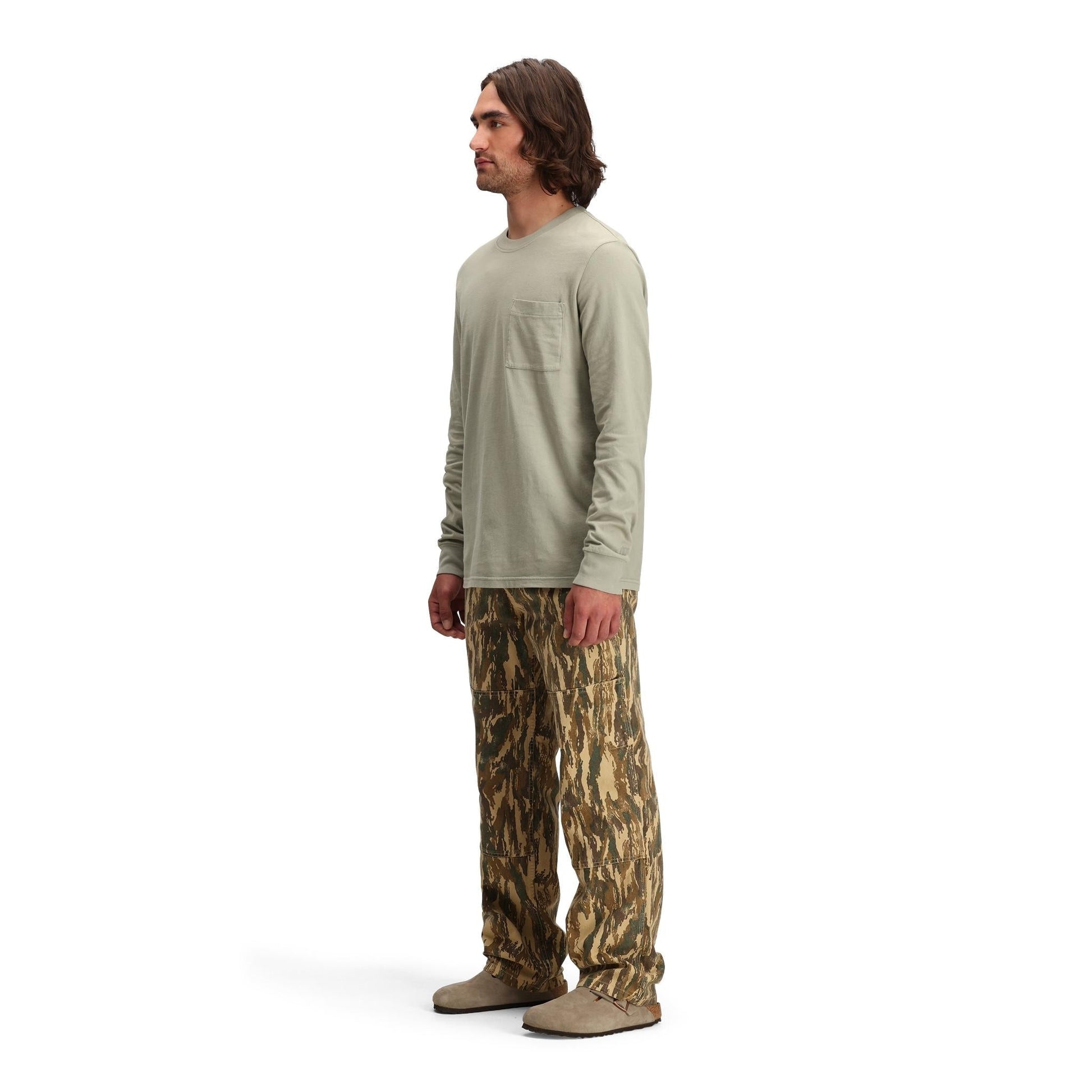 Side model shot of Topo Designs Dirt Pocket Tee Long Sleeve - Men's in "Dried Sage"