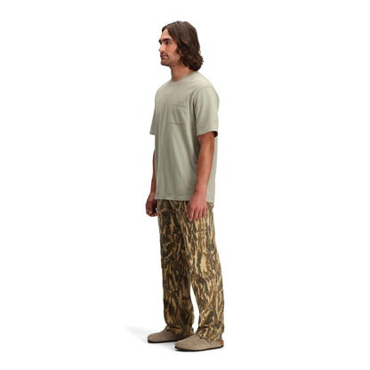 General side model shot of Topo Designs Dirt Pocket Tee - Men's in "Dried Sage"