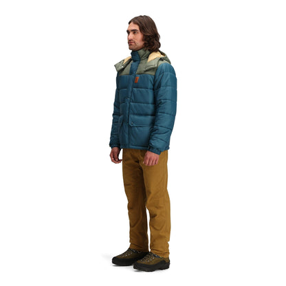 General side model shot of Topo Designs Retro Ridge Puffer Jacket - Men's in "Pond Blue / Beetle"
