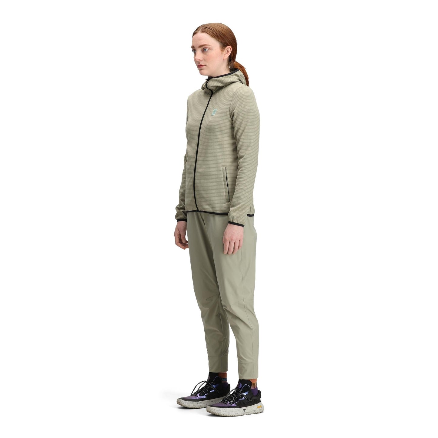 General side model shot of Topo Designs Global Midlayer Hoodie - Women's in "Dried Sage"