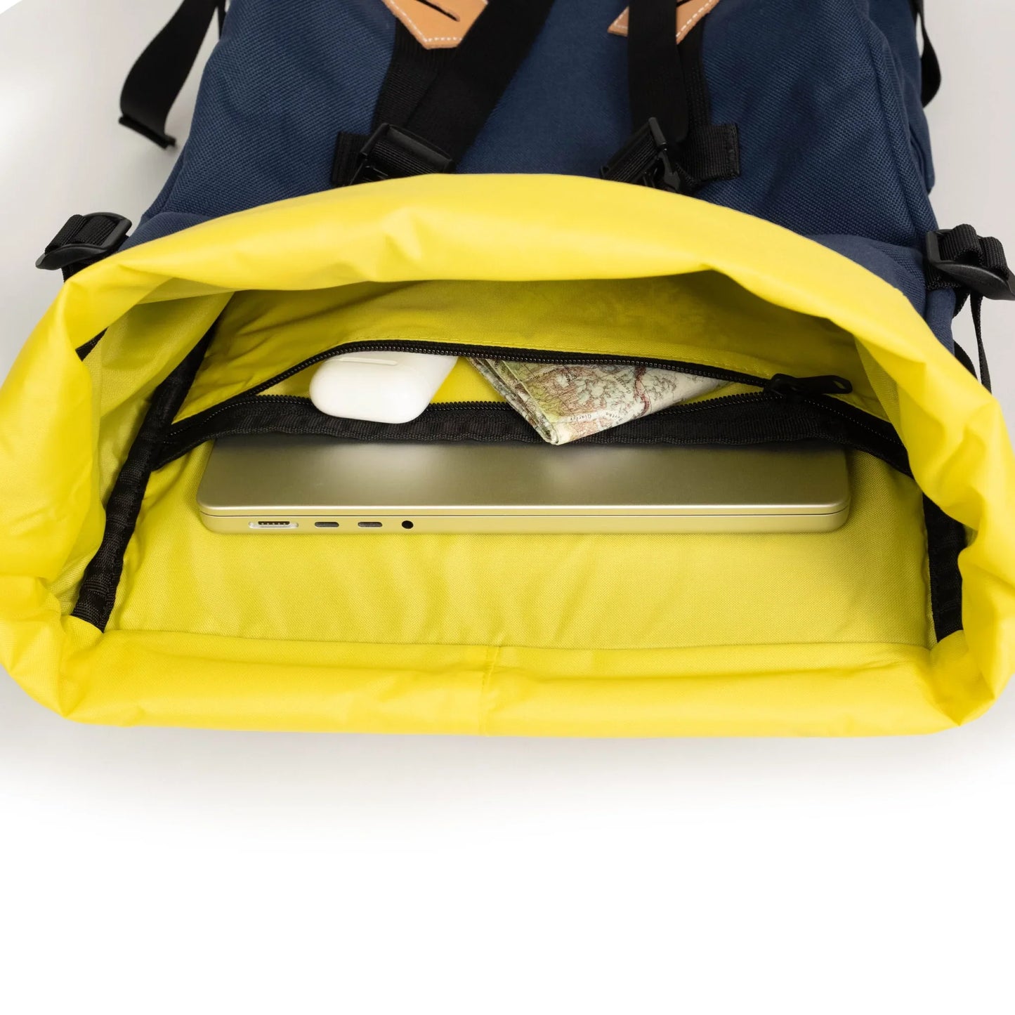 General detail interior image of internal laptop sleeve and zippered pocket inside the Topo Designs Klettersack Classic vintage-inspired rucksack backpack in "Midnight".