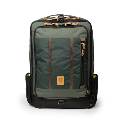 Topo Designs Global Travel Bag 30L Durable Carry On Convertible Laptop Travel Backpack in "Woodland / Forest".