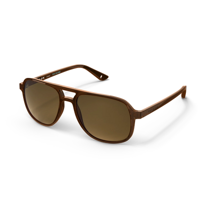 General angled view of VALLON X Topo Designs sunglasses in "Brown / Brown" with sunglass arms open.