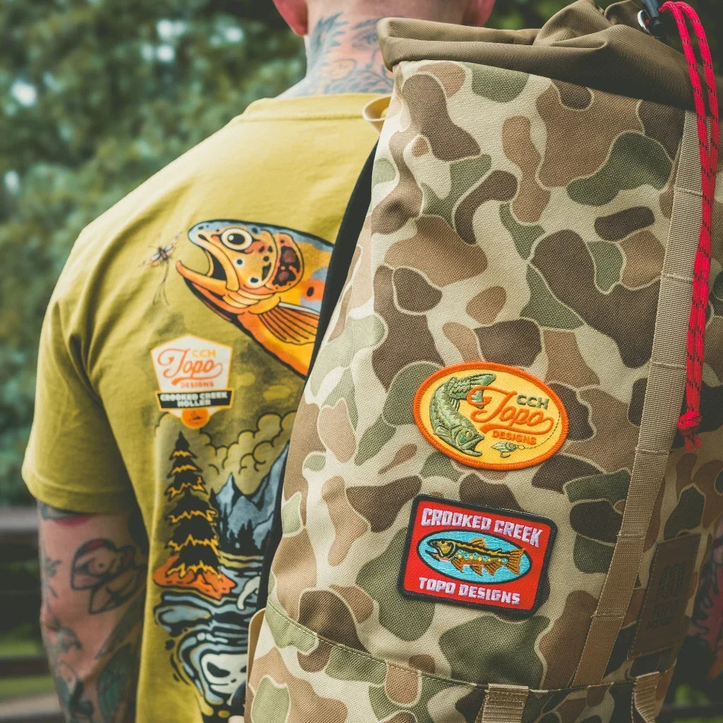 Outdoor detail shot of Topo Designs x CCH x Pine Printshop Patch 2-pack in "Multi"