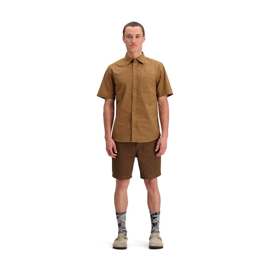 Front model shot of Topo Designs Dirt Desert Shirt Ss - Men's in "Dark Khaki Terrain"