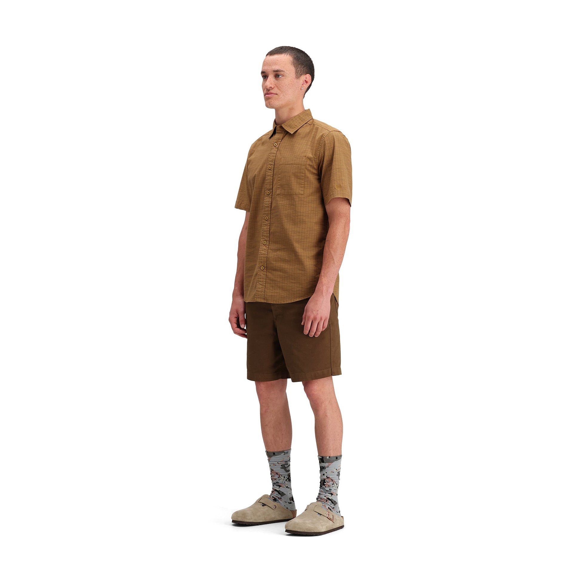 Side model shot of Topo Designs Dirt Desert Shirt Ss - Men's in "Dark Khaki Terrain"