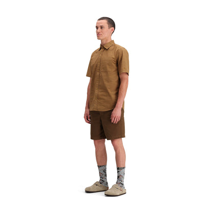 Side model shot of Topo Designs Dirt Desert Shirt Ss - Men's in "Dark Khaki Terrain"