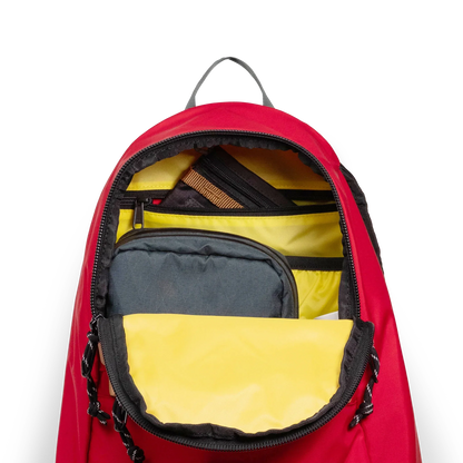General detail view of Topo Designs Classic Teardrop Backpack in "Salsa" with the main compartment opened.