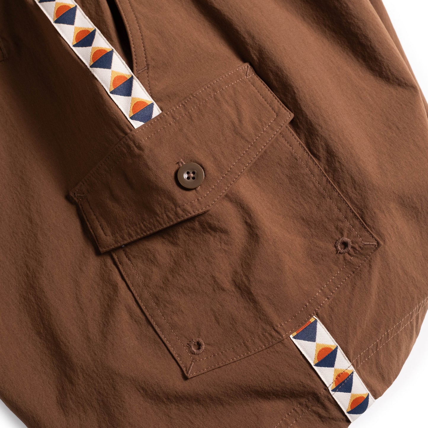 General pocket detail white background flat lay image of Topo Designs Mountain Wave Short - Men's in "Desert Palm"