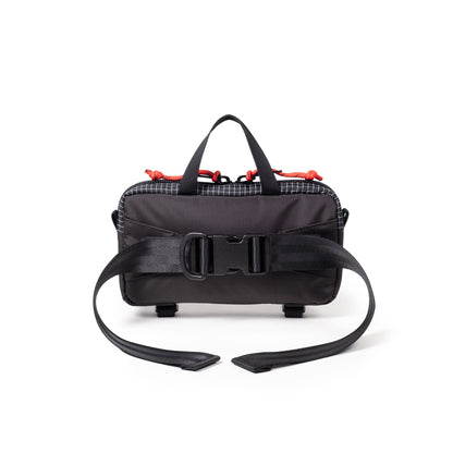 Back View of Topo Designs Mini Quick Pack in "Black Grid"