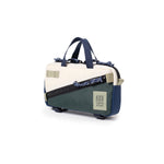 Quarter View of Topo Designs Mini Quick Pack in "Forest / Bone White"