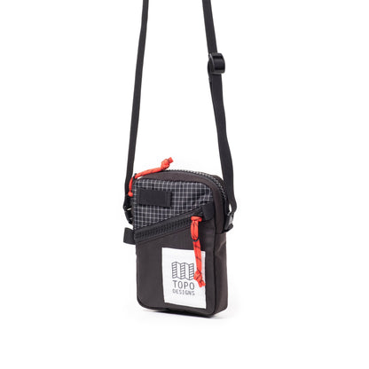Front Quarter View of Topo Designs Mini Shoulder Bag in "Black / White Grid"