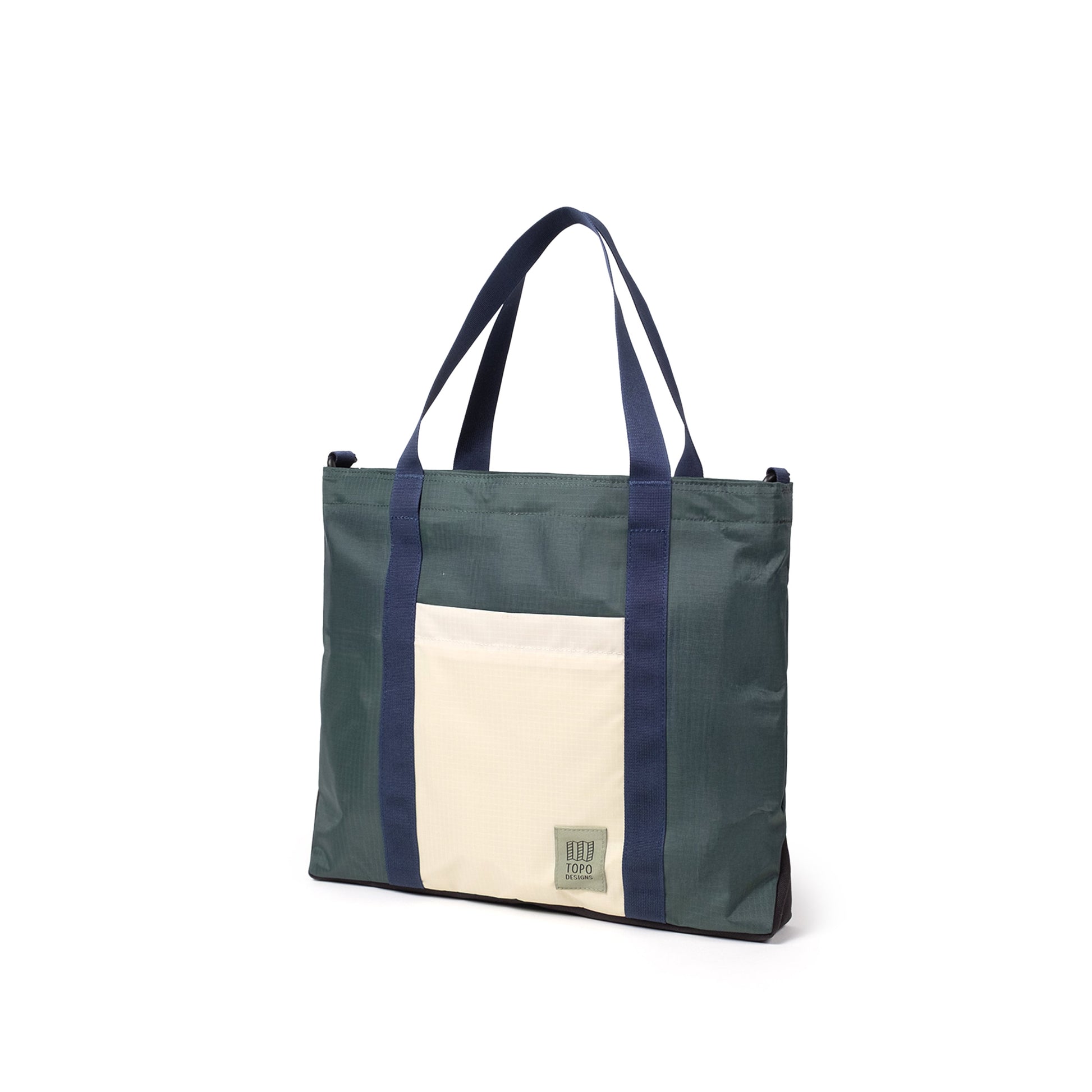 Quarter View of Topo Designs Mountain Essential Tote in "Forest / Bone White"