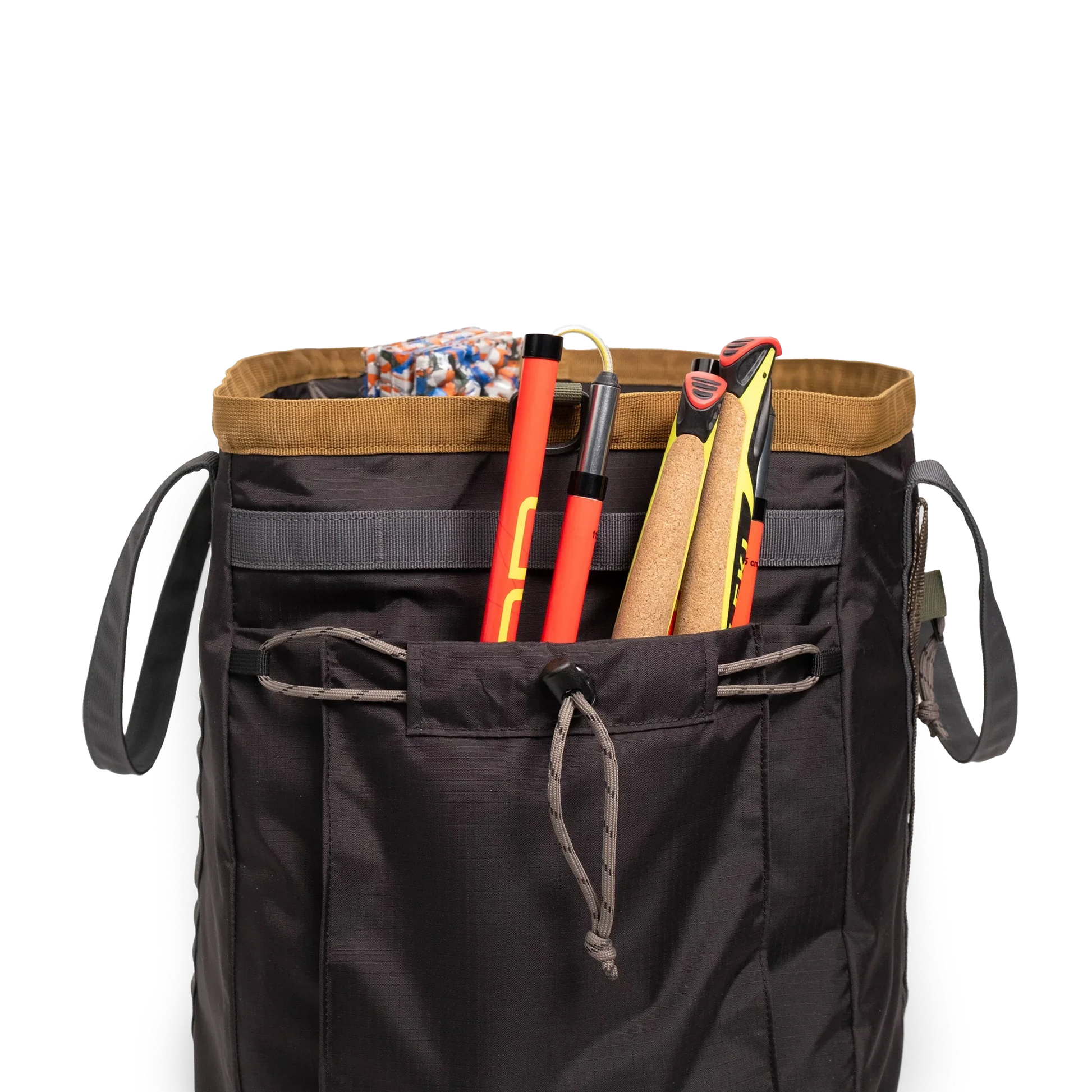 General detail shot of Topo Designs Mountain Gear Bag in "Black / Neutral" with side pocket packed out.
