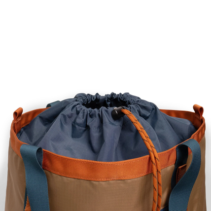 General detail shot of Topo Designs Mountain Utility Tote cinch top enclosure in "Olive / Dark Khaki".