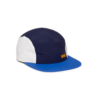 Front quarter white background image of Topo Designs Global Hat in "Cobalt / Midnight"