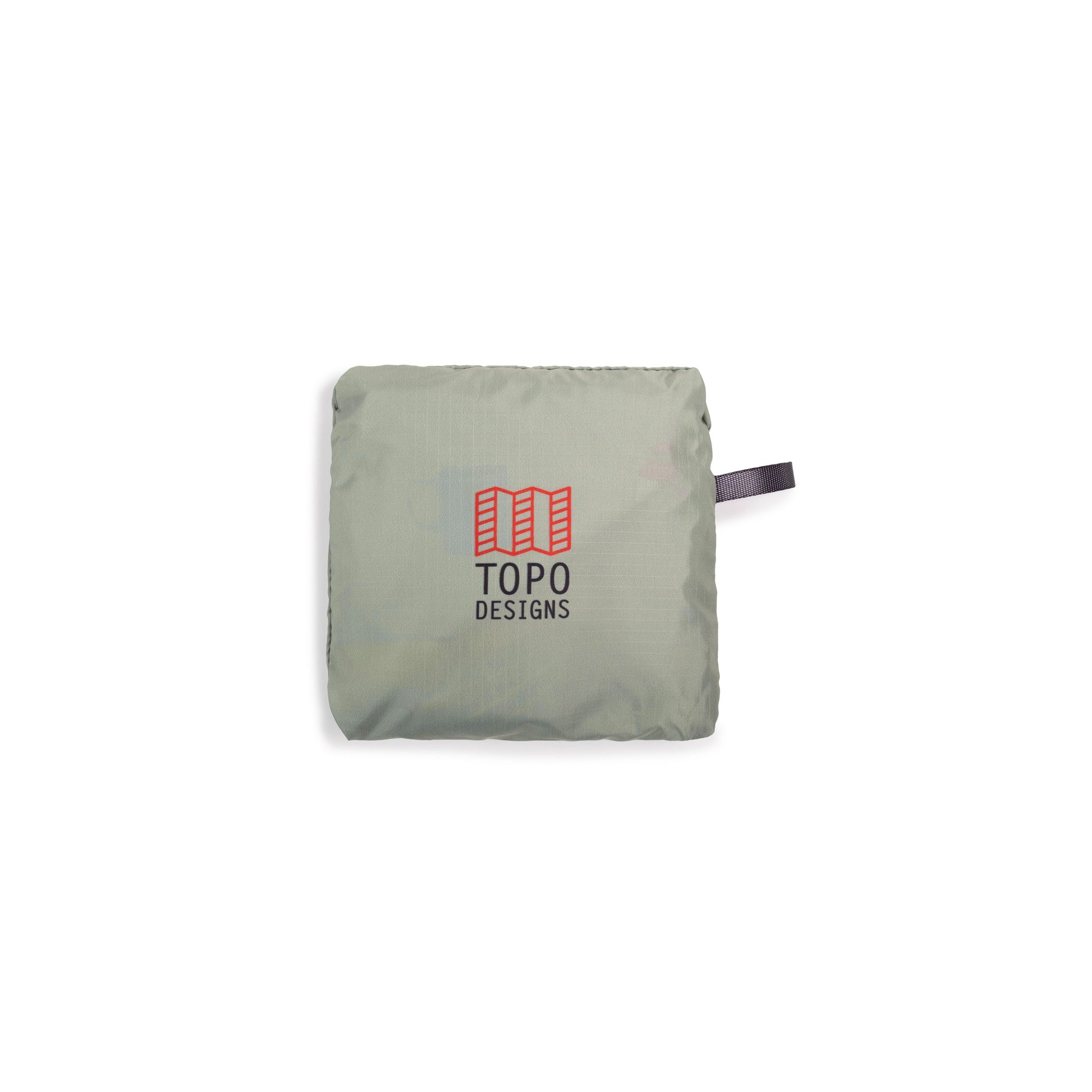 Shot of Topo Designs Packable Tote in "Oil Green" packed in bag