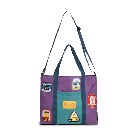 Front image of Topo Designs x AWA Mountain Essential Tote in "Loganberry / Caribbean" with shoulder strap extended