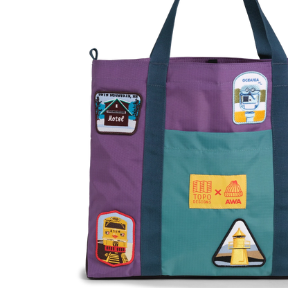 Front exterior detail image of Topo Designs x AWA Mountain Essential Tote in "Loganberry / Caribbean"