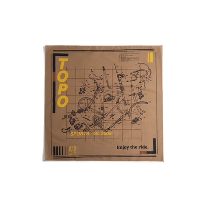 Front flay lay image of Topo Designs x Pine Printshop Enjoy The Ride Bandana in "Sand"